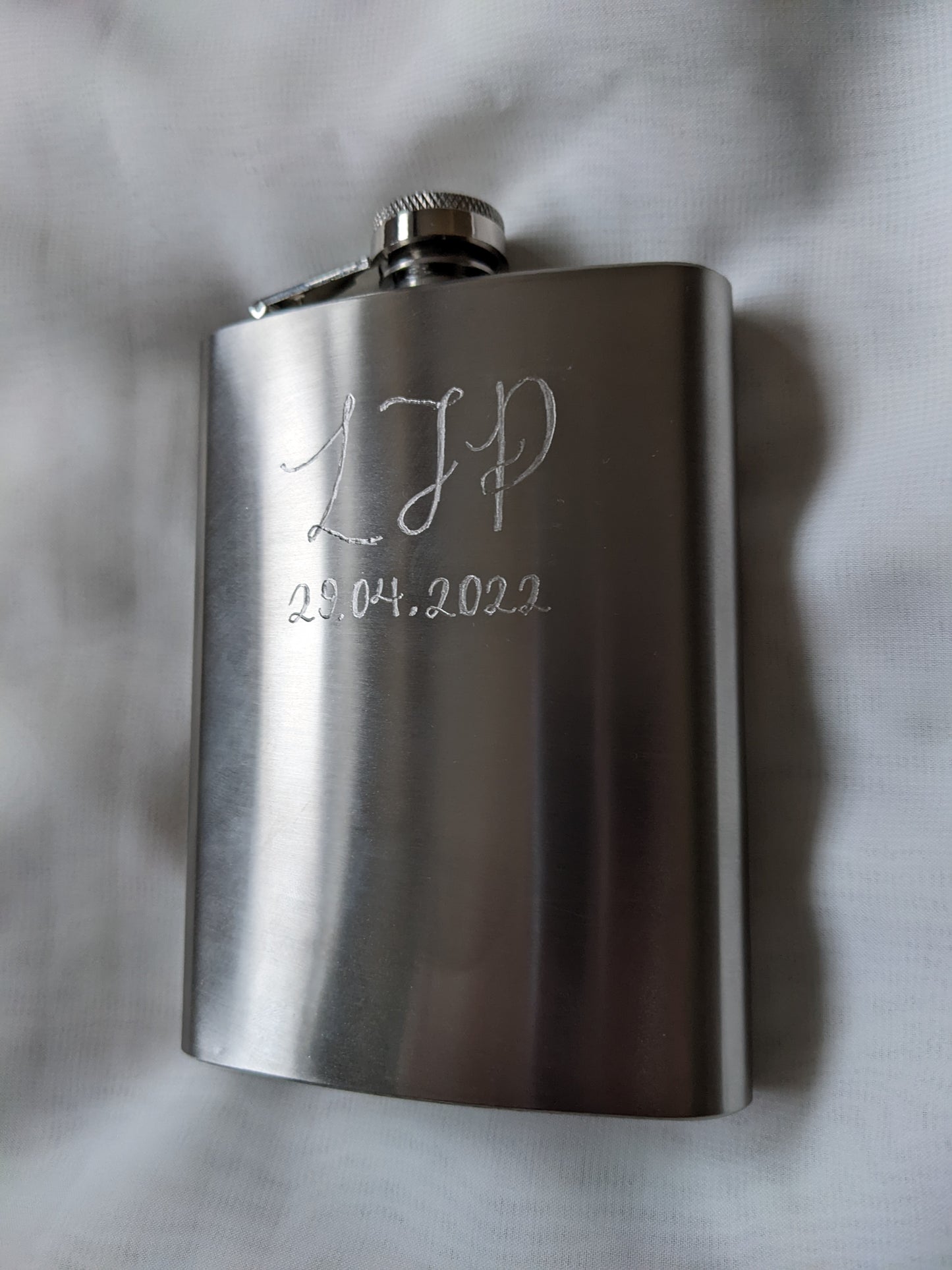Engraved hip flasks
