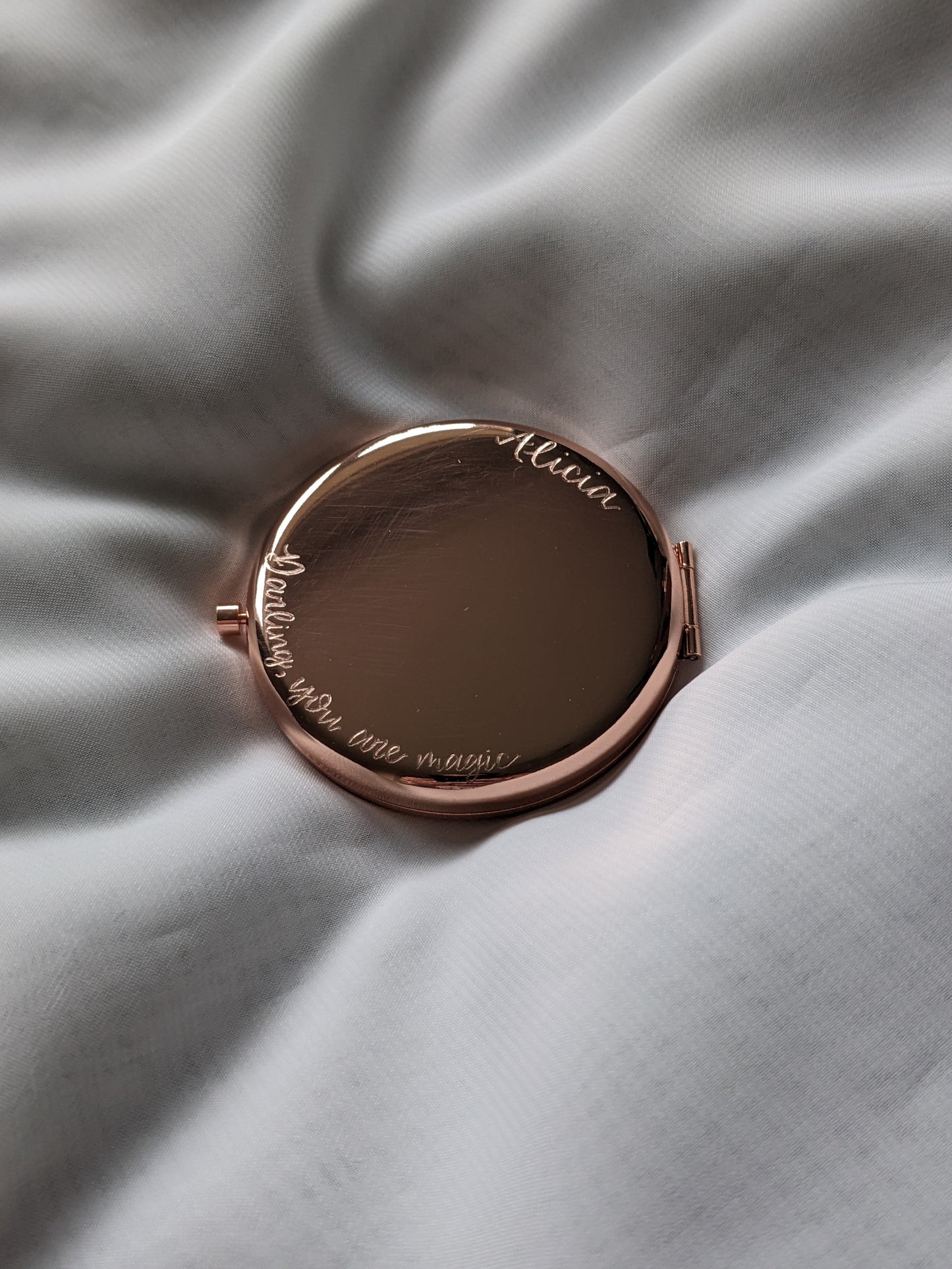 Engraved compact mirror