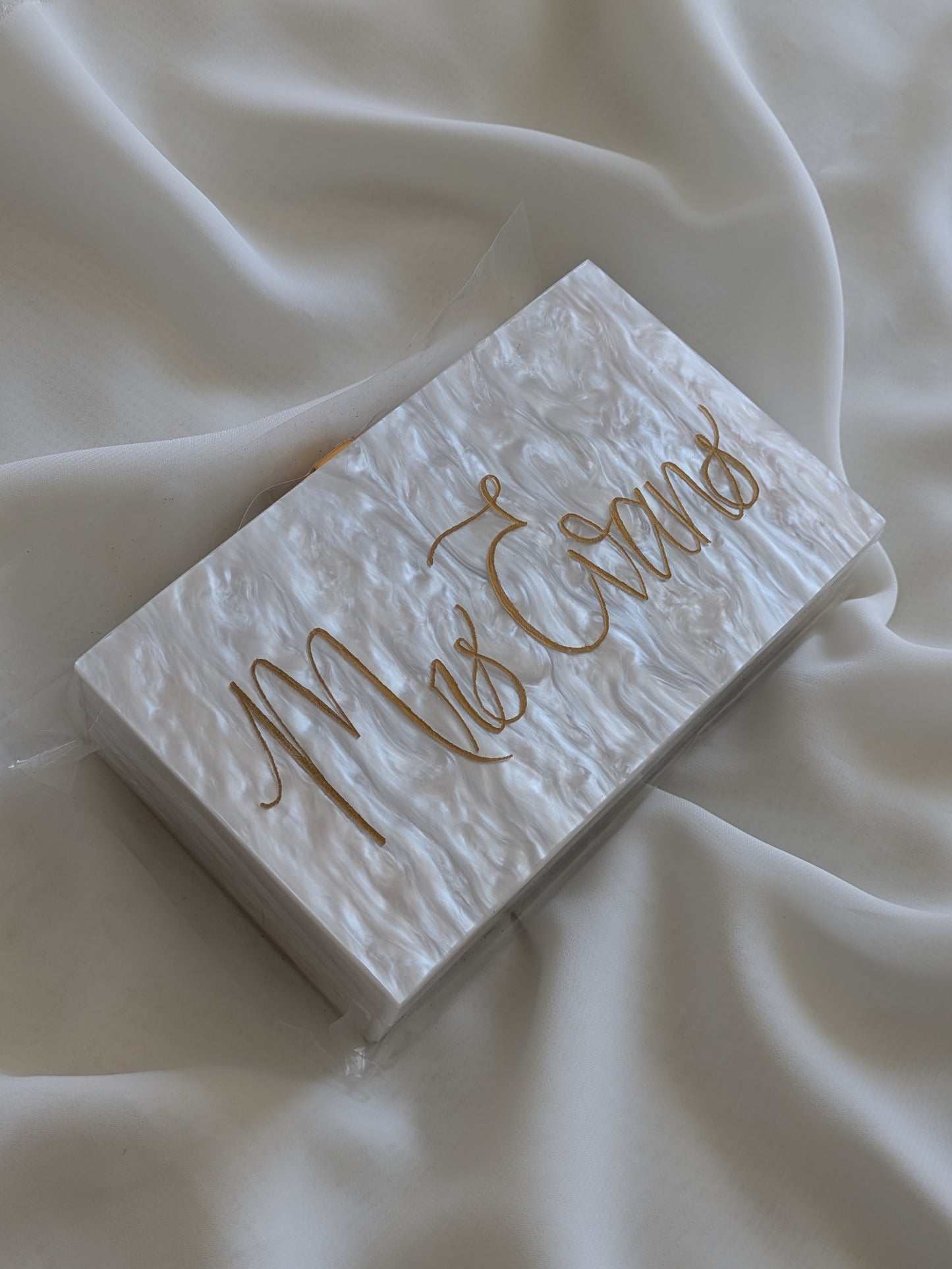 Engraved acrylic clutch