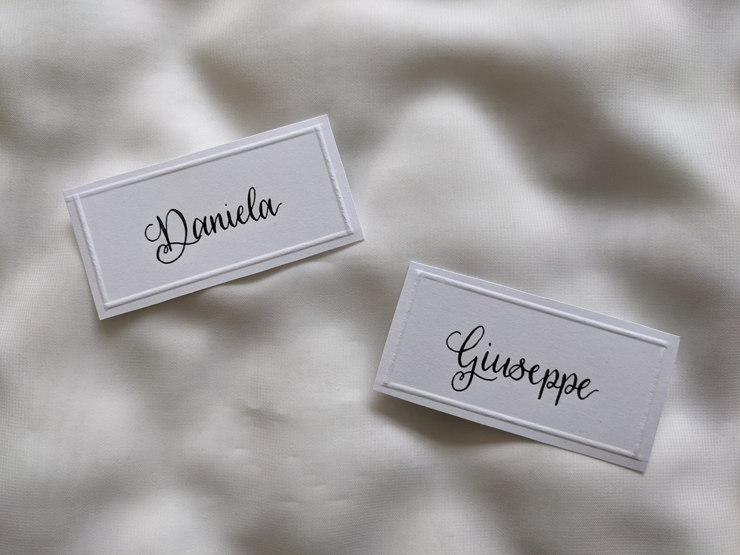 Embossed card place names